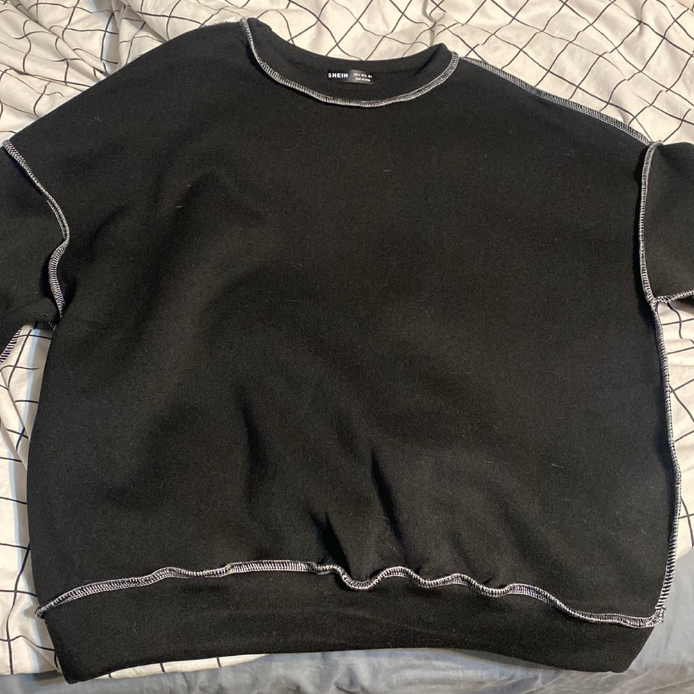 Black oversized crew neck with white stitching